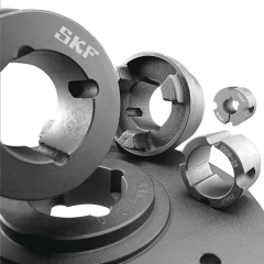 Mehrere graue runde Bauteile mit Aussparungen und SKF-Aufdruck